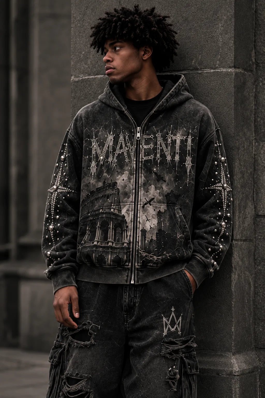AI campaign concept: closer view of the Ruins - Colosseum hoodie, showing the Roman ruins print, silver zipper and crystal details against charcoal stone.