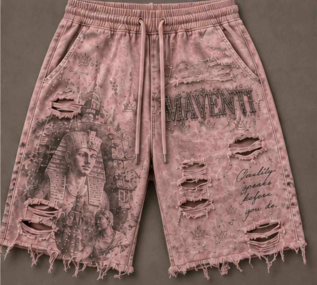 Ruins - Luxor shorts close-up: original Maventi crown accents, MAVENTI lettering, ruins artwork, open horizontal rips and raw frayed hems on washed-pink fabric.